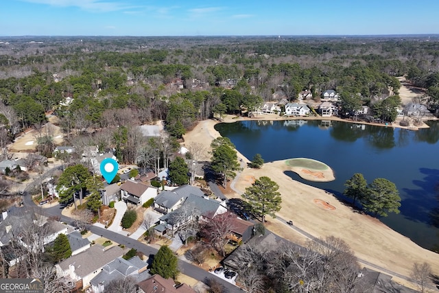 drone / aerial view featuring a water view and a residential view