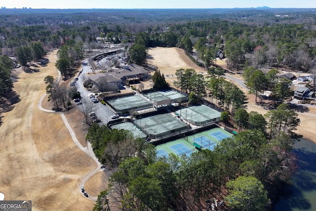 birds eye view of property with a forest view