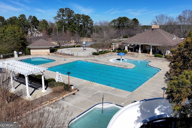 community pool featuring a patio area and a pergola