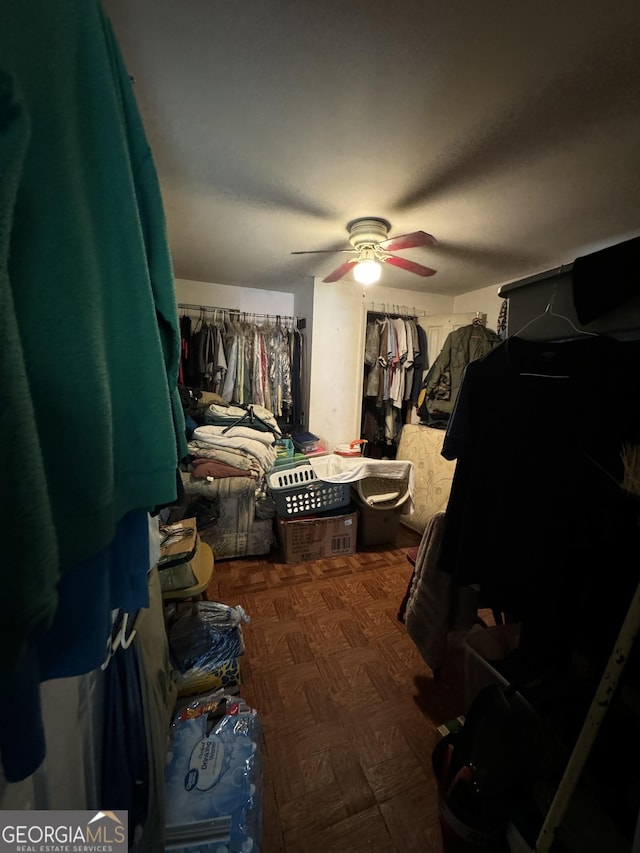 spacious closet with ceiling fan