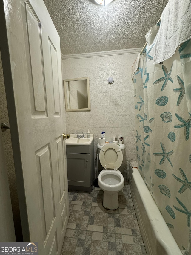 full bathroom with a textured ceiling, toilet, vanity, ornamental molding, and shower / tub combo with curtain