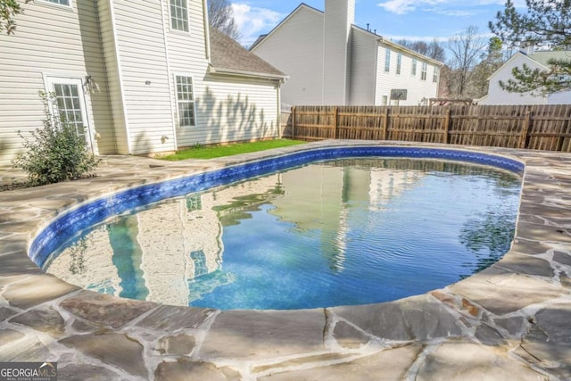 view of pool featuring a fenced backyard and a fenced in pool