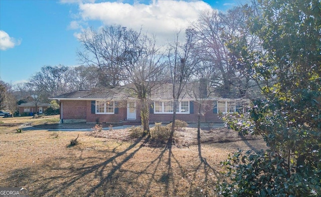 ranch-style house with brick siding