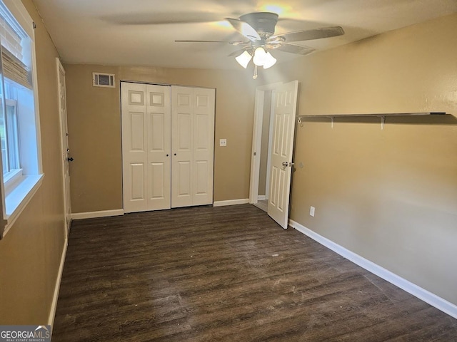 117 Triune Mill Rd, Thomaston, GA 30286 - unfurnished bedroom with dark wood-style flooring, baseboards, a closet, and a ceiling fan