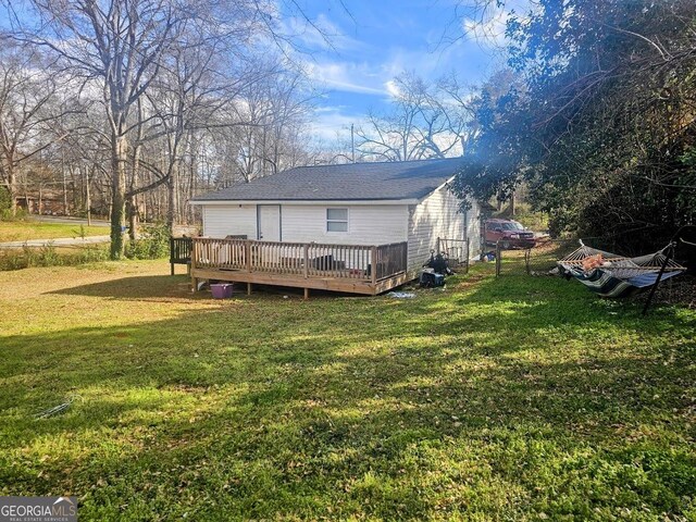 117 Triune Mill Rd, Thomaston, GA 30286 - back of property with a deck, a yard, and roof with shingles