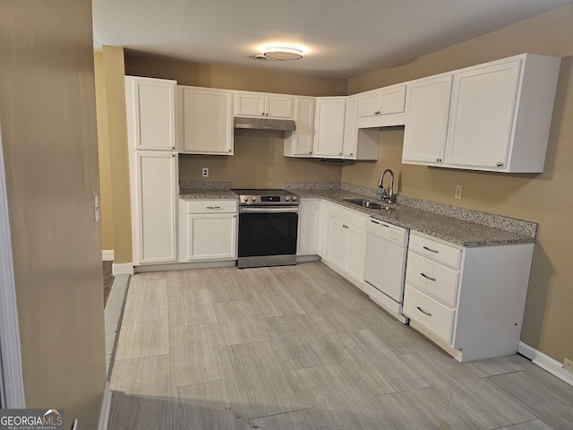 117 Triune Mill Rd, Thomaston, GA 30286 - kitchen featuring stainless steel electric range, white dishwasher, a sink, under cabinet range hood, and baseboards