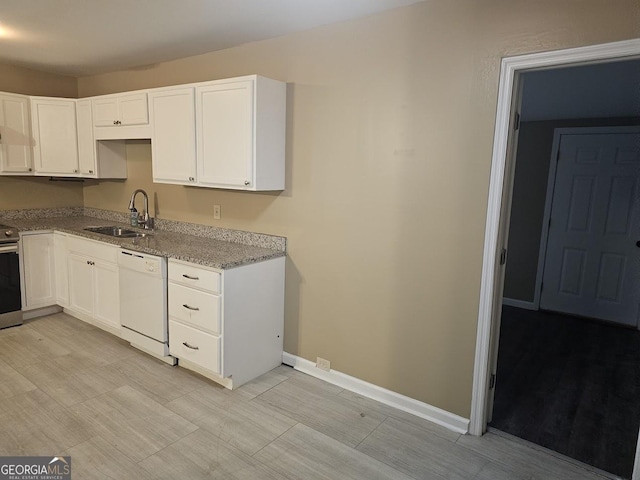 117 Triune Mill Rd, Thomaston, GA 30286 - kitchen featuring a sink, dishwasher, stainless steel range with electric stovetop, light stone counters, and white cabinetry