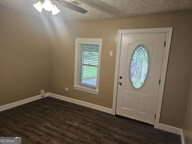 117 Triune Mill Rd, Thomaston, GA 30286 - foyer with dark wood-style floors, a textured ceiling, ceiling fan, and baseboards