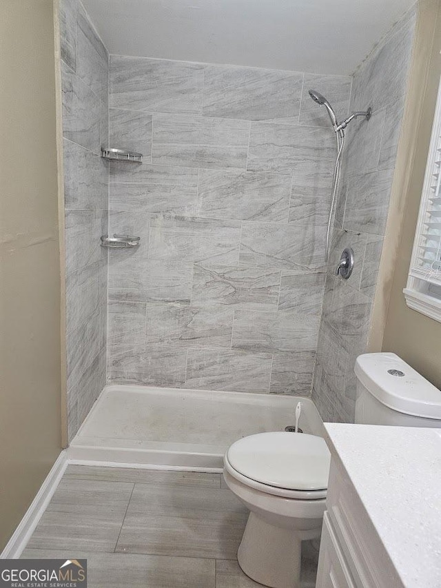 117 Triune Mill Rd, Thomaston, GA 30286 - full bathroom with toilet, a tile shower, and vanity