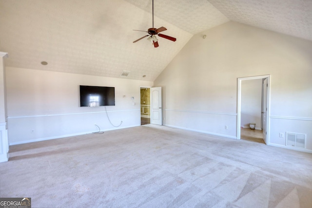 unfurnished living room with high vaulted ceiling, carpet, visible vents, and ceiling fan