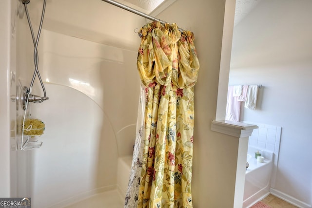 full bath featuring curtained shower and a bathtub