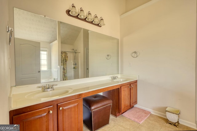 bathroom featuring double vanity, a shower with shower curtain, a sink, and baseboards