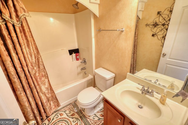 bathroom with shower / tub combo, vanity, and toilet