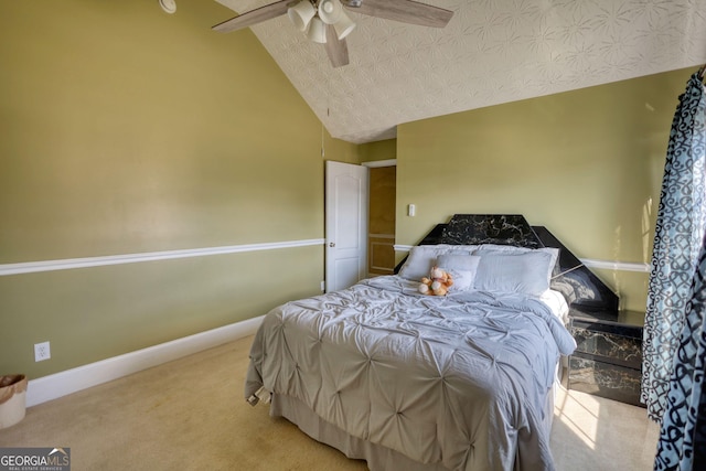 carpeted bedroom featuring ceiling fan, baseboards, vaulted ceiling, and a textured ceiling