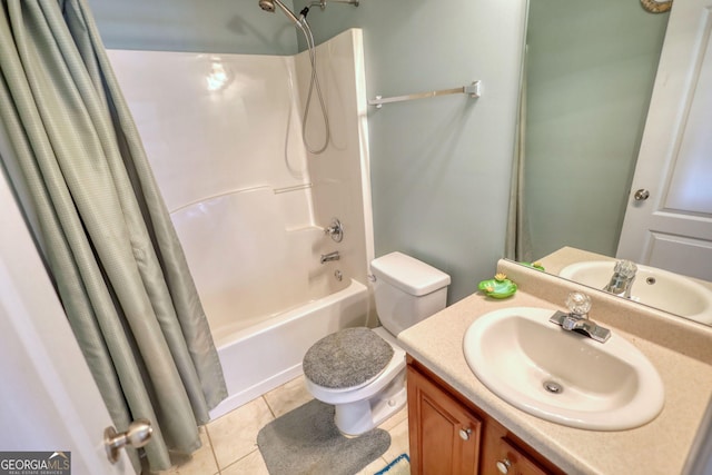 bathroom featuring shower / bath combination with curtain, vanity, toilet, and tile patterned floors