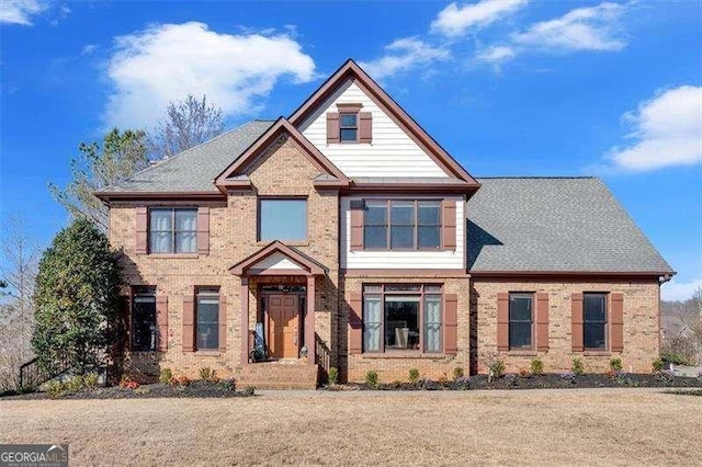 view of front of house featuring brick siding