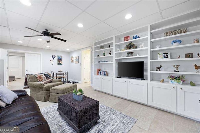 living area featuring light tile patterned flooring, recessed lighting, a ceiling fan, and built in features