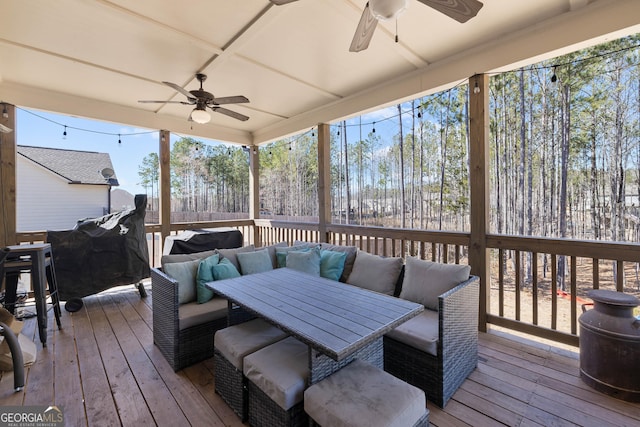 deck with ceiling fan and outdoor dining area