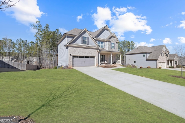 view of front facade with driveway, an attached garage, fence, a front lawn, and brick siding