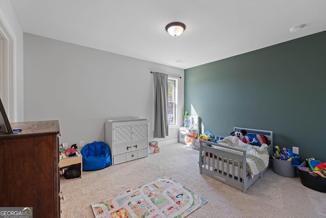 bedroom with light carpet and visible vents