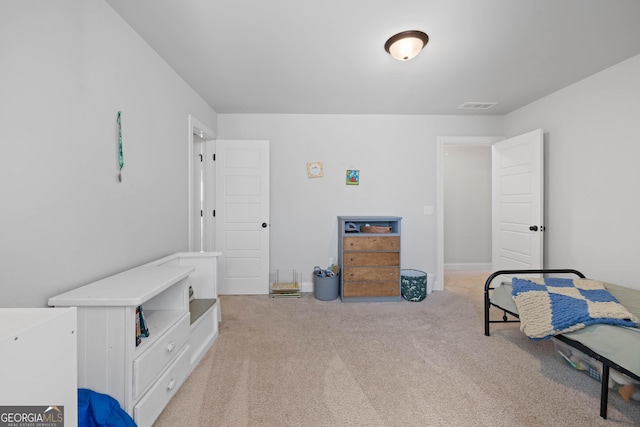 bedroom featuring light carpet and visible vents