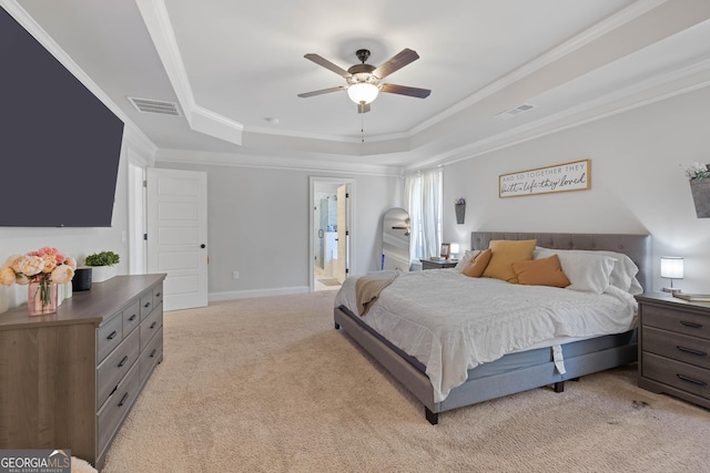 bedroom featuring ornamental molding, visible vents, a raised ceiling, and light colored carpet