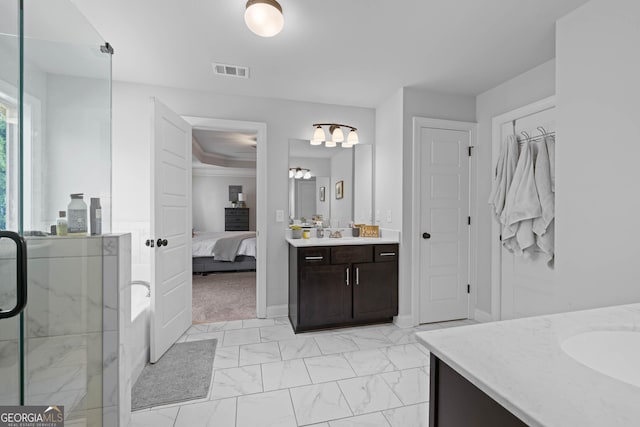 full bath with marble finish floor, visible vents, a shower stall, ensuite bath, and vanity