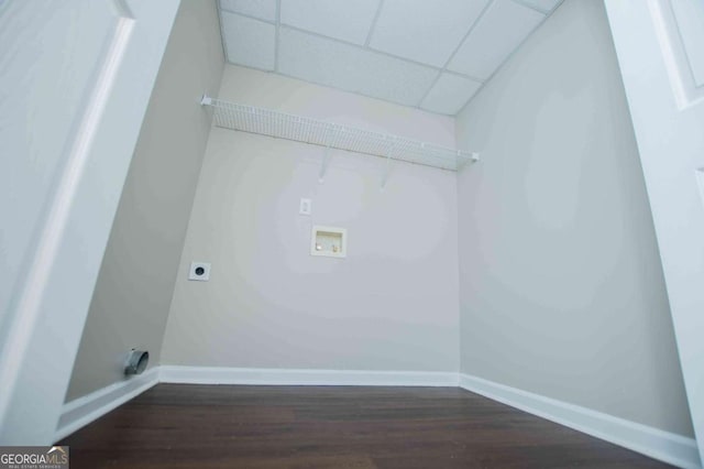 laundry area featuring dark wood-style floors, laundry area, hookup for an electric dryer, and baseboards