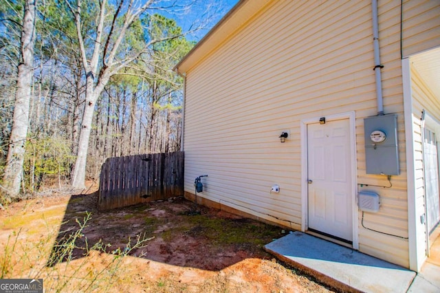 view of home's exterior featuring fence