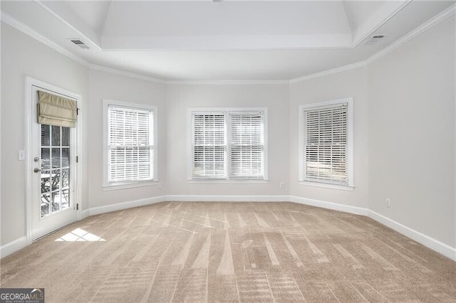 empty room with light carpet, baseboards, visible vents, and crown molding