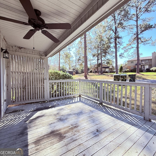 deck featuring a residential view and ceiling fan