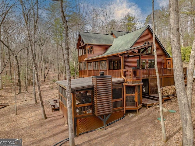 exterior space featuring log veneer siding