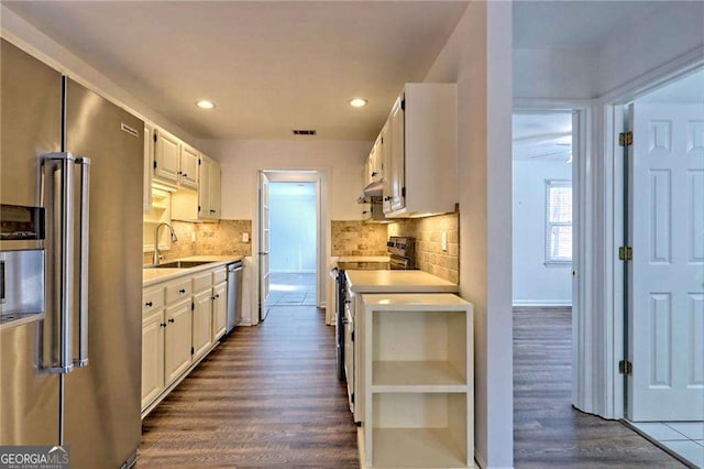 kitchen featuring open shelves, stainless steel appliances, visible vents, light countertops, and white cabinetry