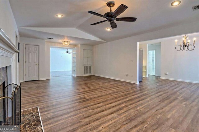 185 Starlight Dr, Sautee Nacoochee, GA 30571 - unfurnished living room with vaulted ceiling, a fireplace, dark wood-style floors, visible vents, and ceiling fan with notable chandelier