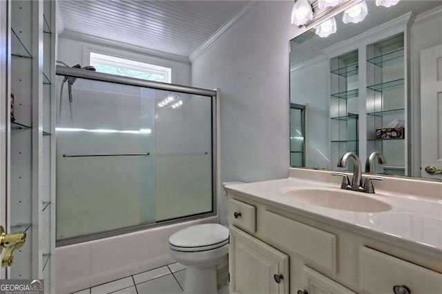 bathroom with toilet, shower / bath combination with glass door, tile patterned flooring, crown molding, and vanity