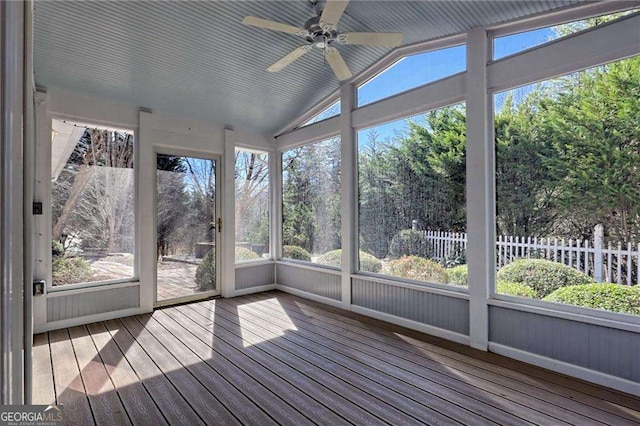 unfurnished sunroom featuring ceiling fan and vaulted ceiling