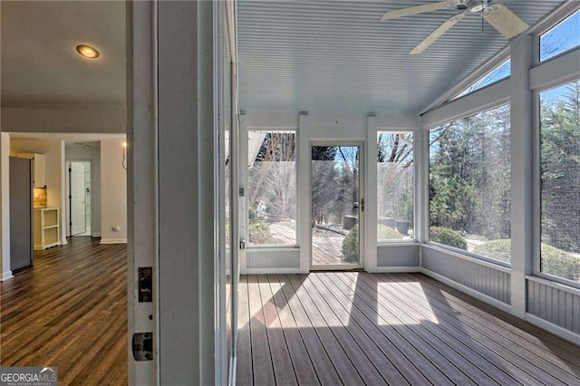 unfurnished sunroom with ceiling fan and lofted ceiling