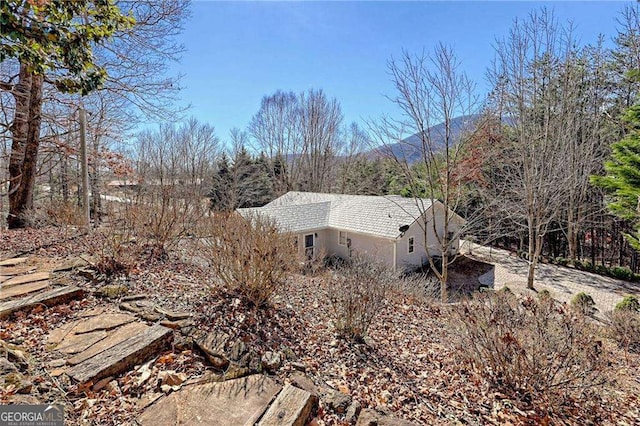 view of home's exterior featuring a mountain view