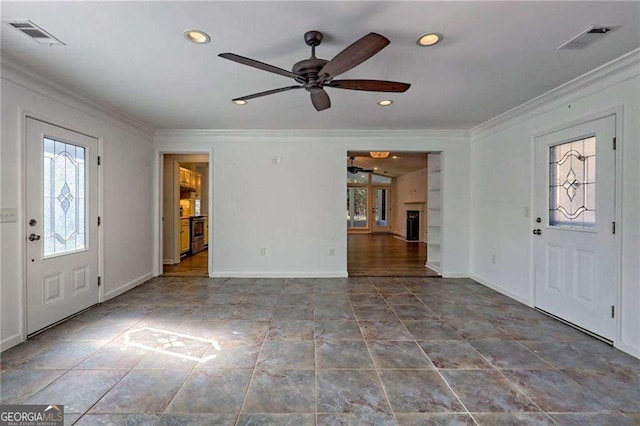 entrance foyer with baseboards, visible vents, and ornamental molding