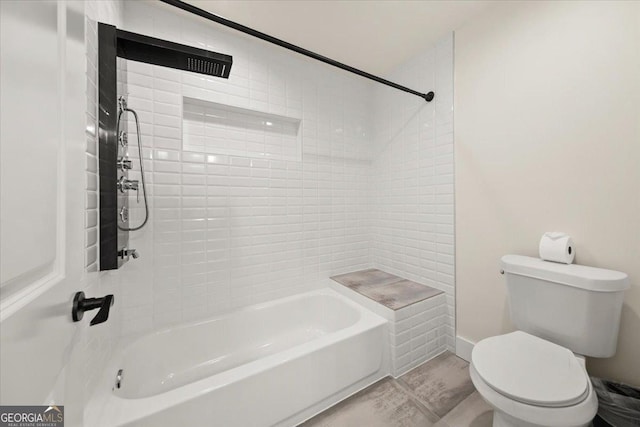 bathroom featuring toilet and shower / bath combination