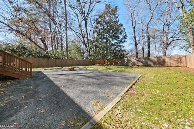 view of yard with a fenced backyard