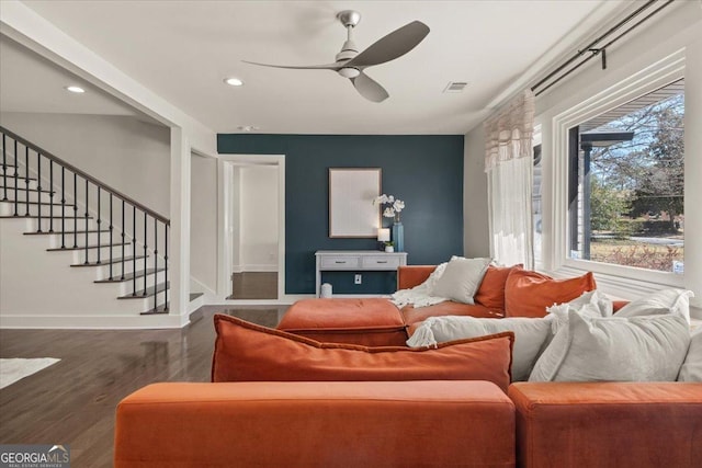 living area featuring recessed lighting, ceiling fan, wood finished floors, baseboards, and stairs