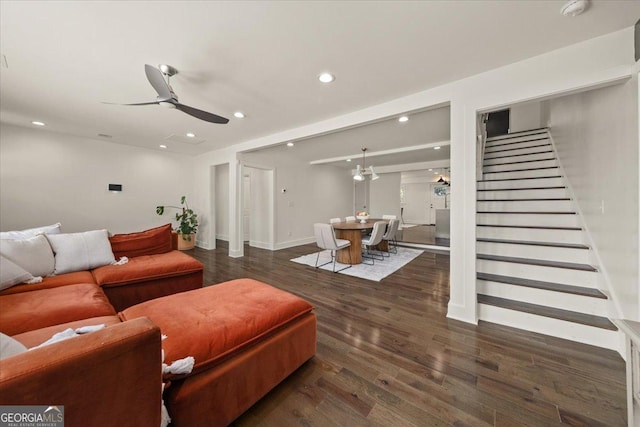 living area with baseboards, ceiling fan, wood finished floors, stairs, and recessed lighting