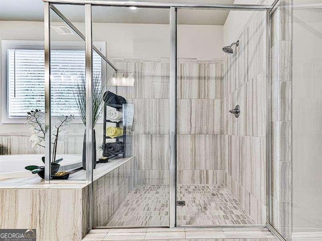 bathroom with tiled shower