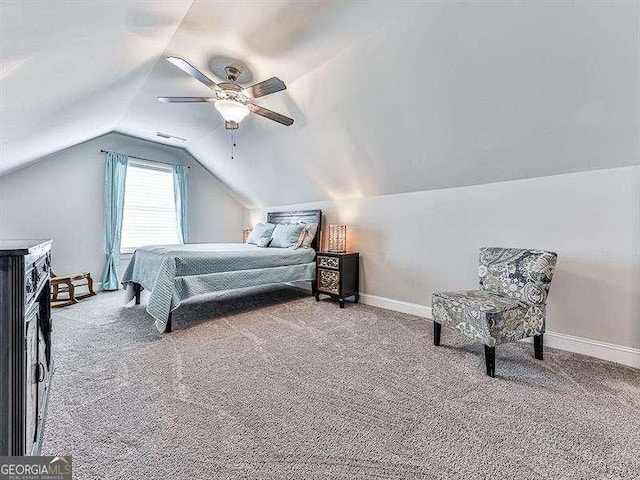 carpeted bedroom featuring ceiling fan, baseboards, and vaulted ceiling