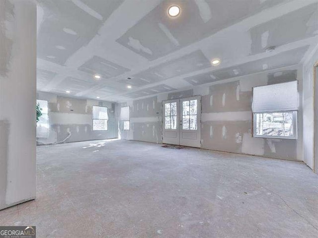 unfurnished living room with french doors