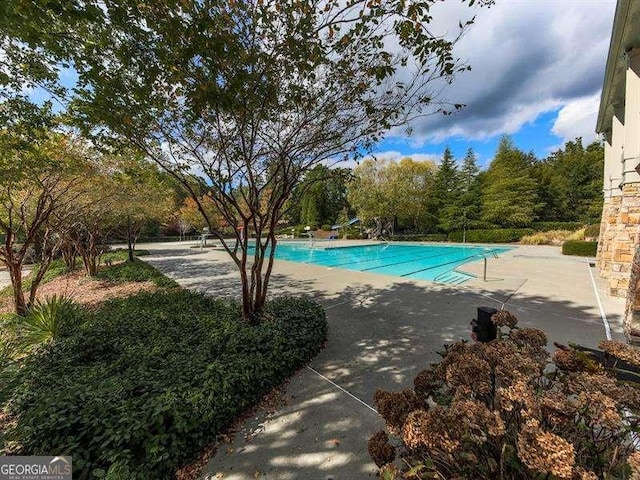 pool with a patio area