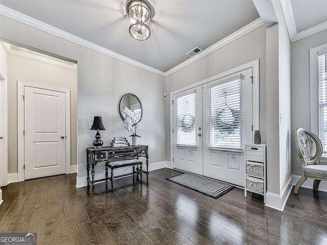 foyer featuring dark wood-style flooring, baseboards, crown molding, and french doors