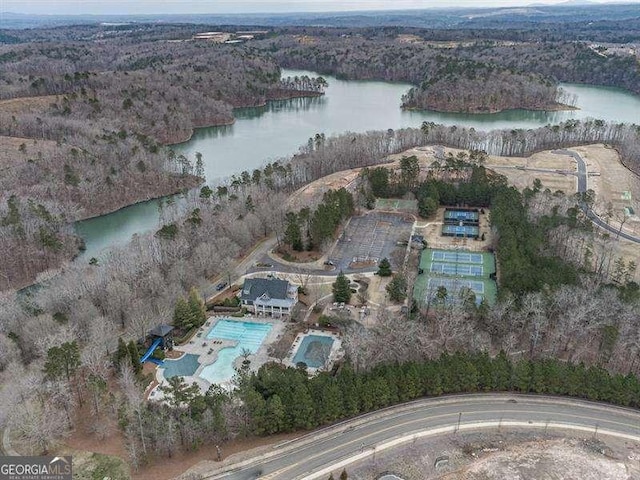 aerial view featuring a water view and a view of trees