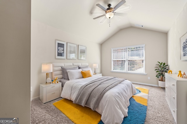 bedroom with baseboards, visible vents, vaulted ceiling, and light colored carpet